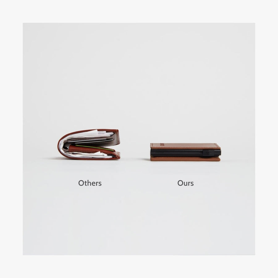 Oxford Blue / Black | Side-by-side comparison of a bulky traditional wallet labeled 