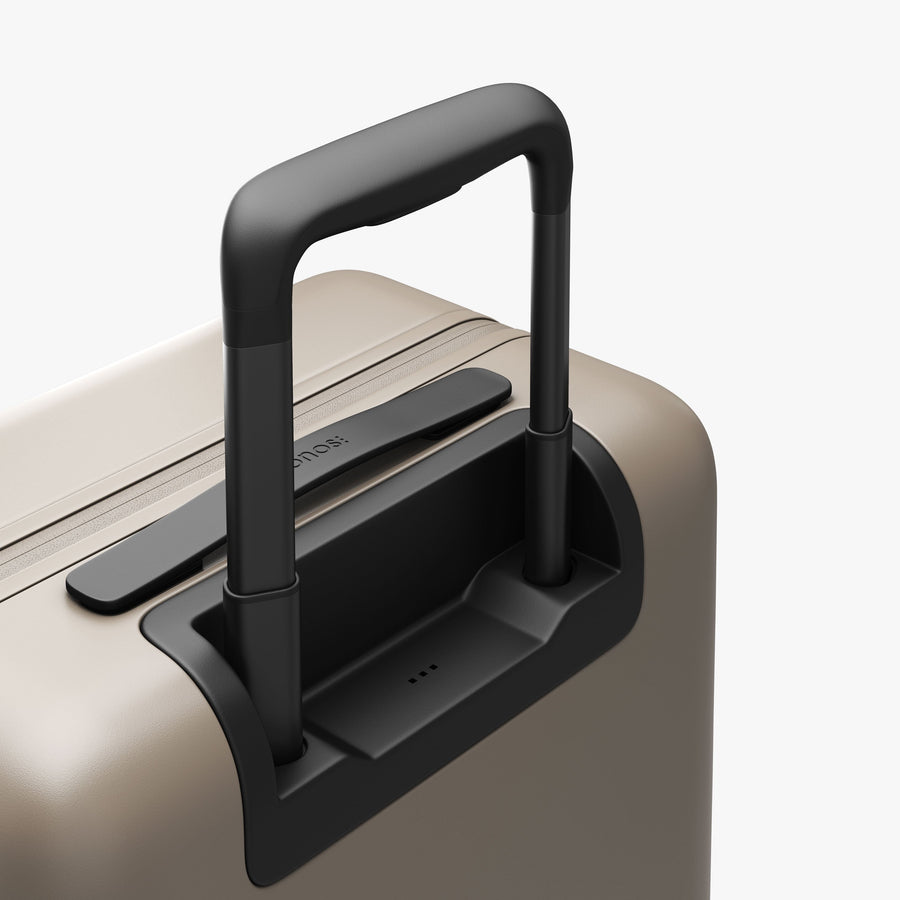 Desert Taupe | Extended luggage handle view of Carry-On in Desert Taupe