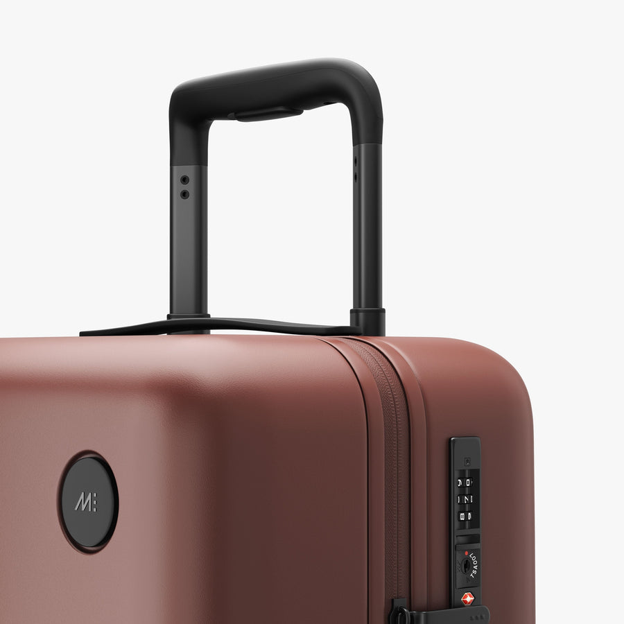 Terracotta | Luggage handle view of Carry-On in Terracotta