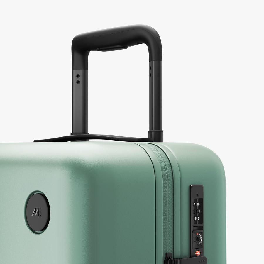 Sage Green | Luggage handle view of Carry-On in Sage Green